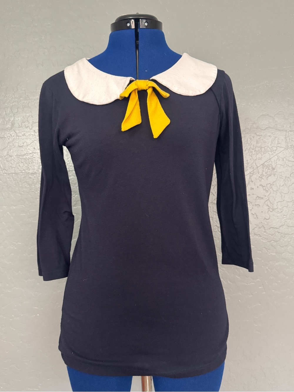 RockSteady Navy 3/4-Sleeve Top with White Peter Pan Collar & Yellow Bow